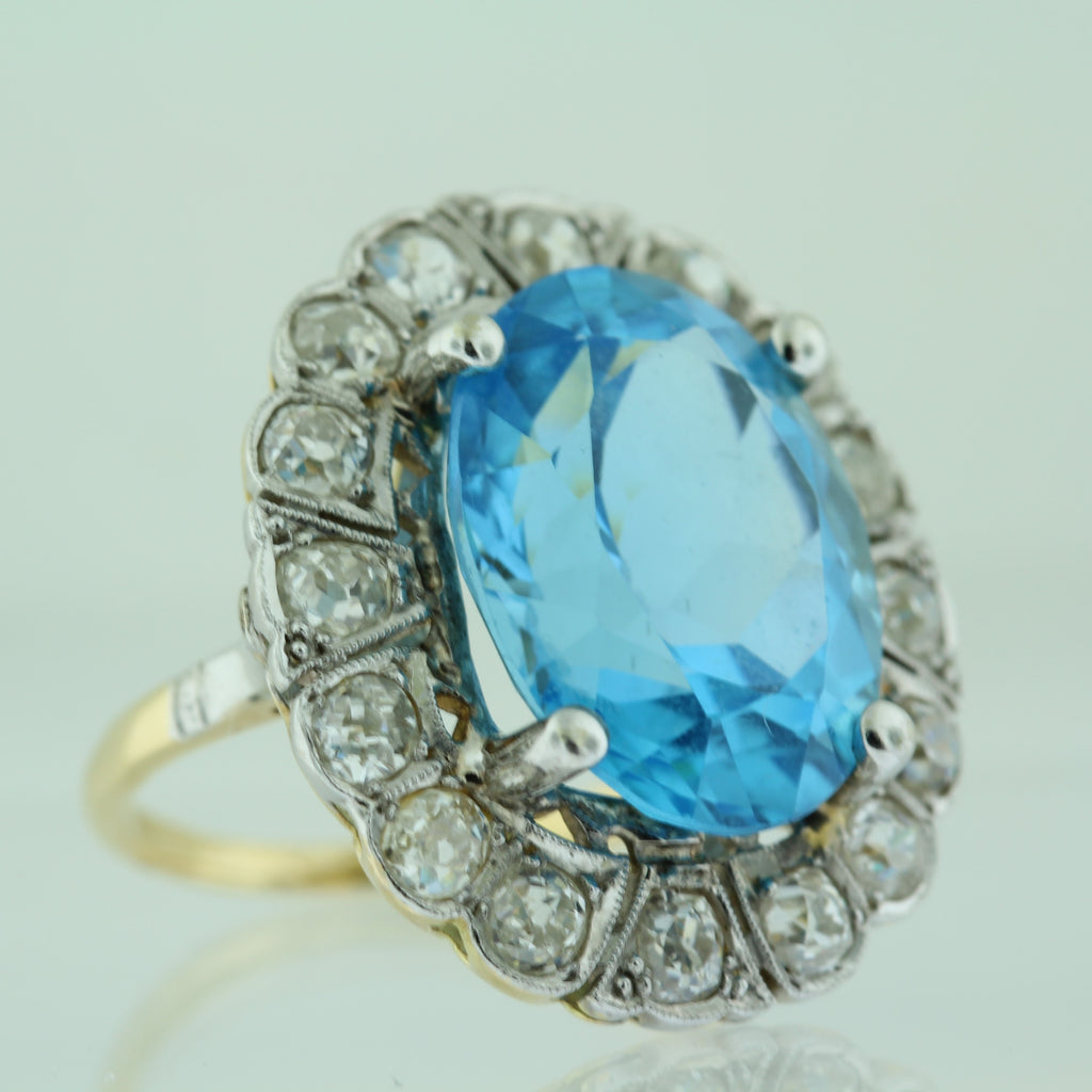18k Yellow Gold Oval Blue Topaz (15.00ct) with Diamond (1.50ct) Halo Ring